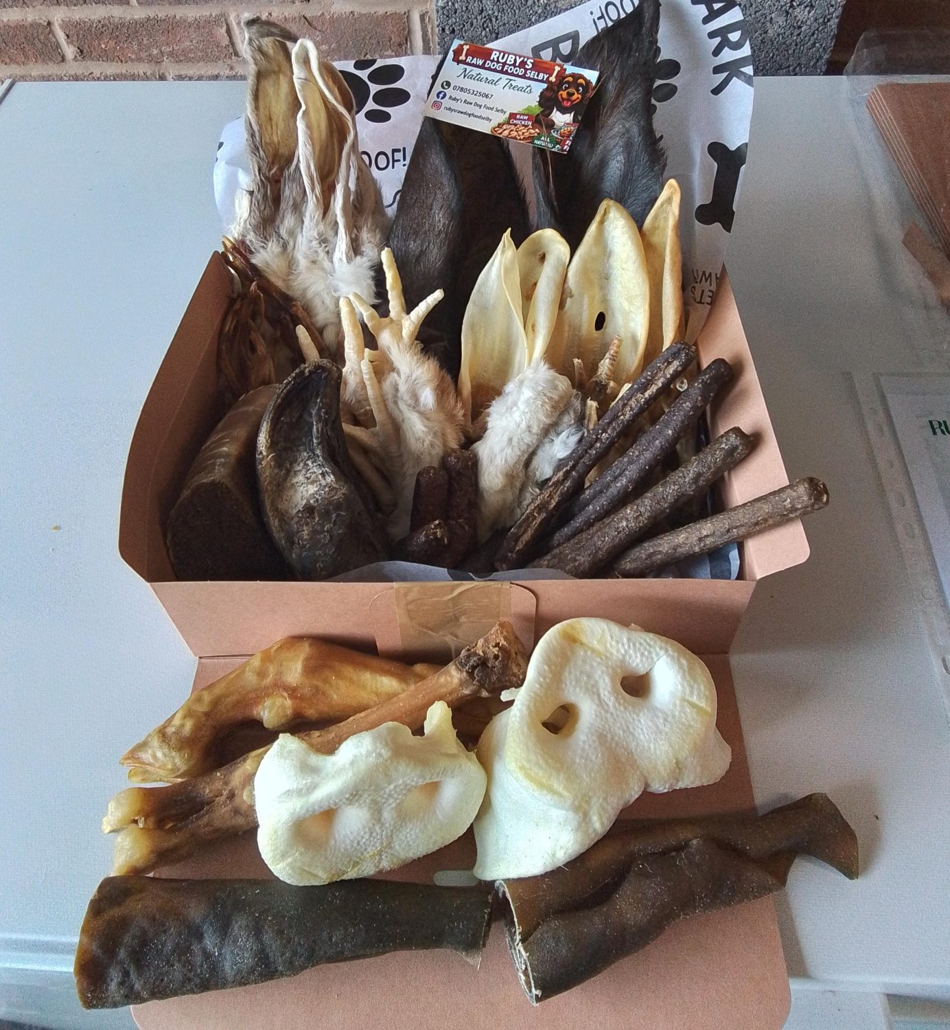 Large mixed box of natural dog chews and treats